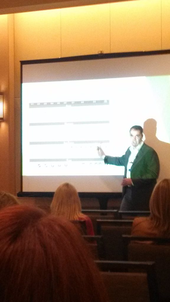 Link Miller presenting in a theatre