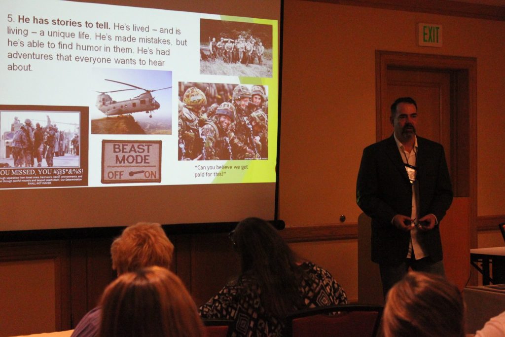 Link Miller presenting to an audience